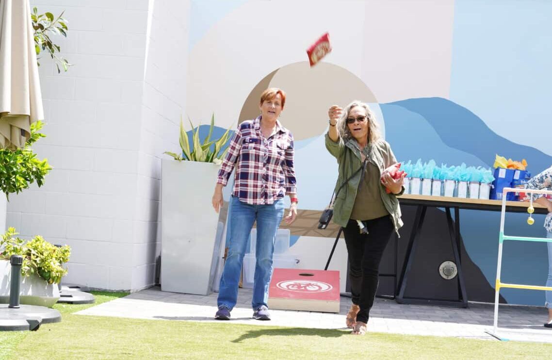 Photo of staff playing cornhole