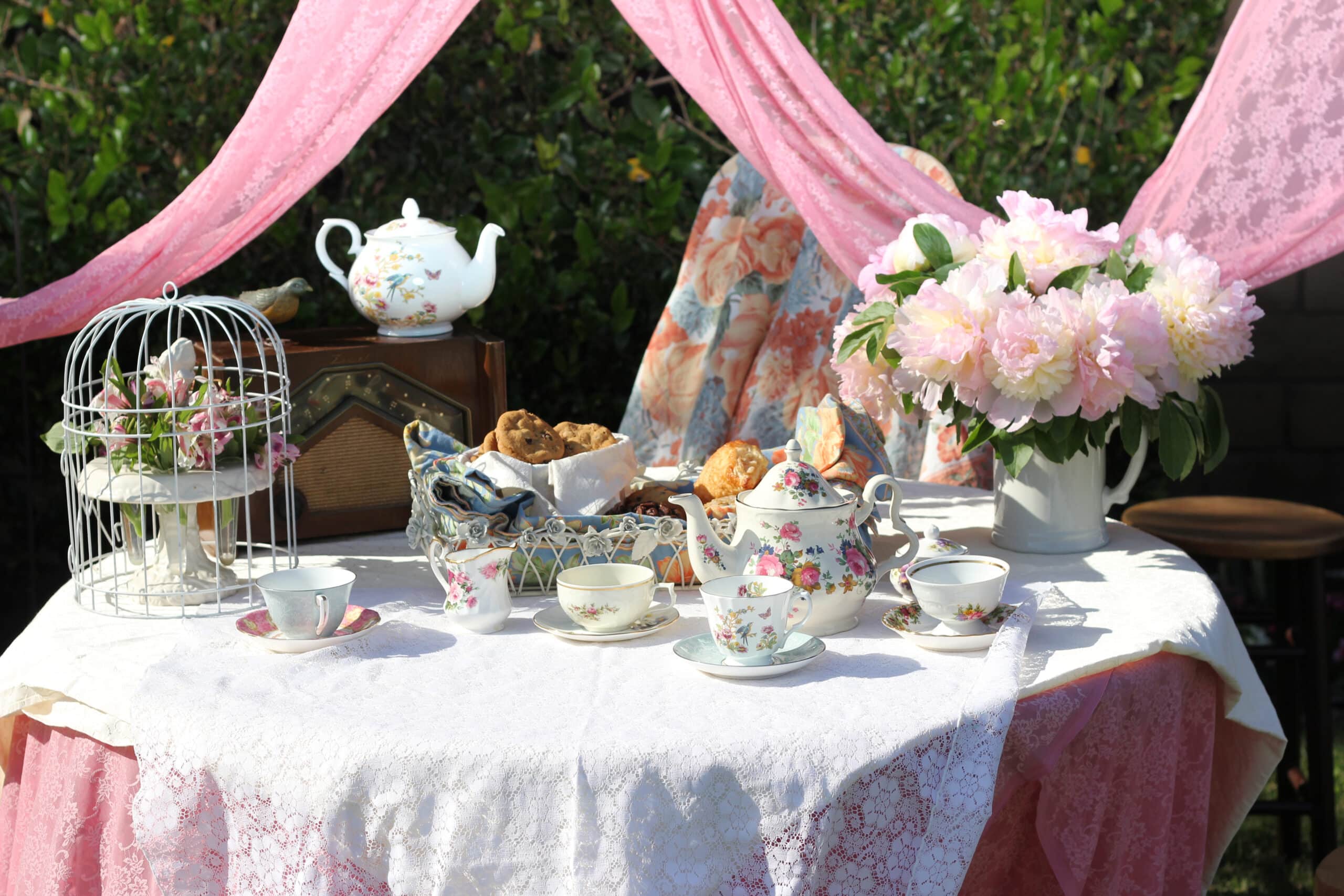 Photo of set table with glasses, silverware and plates